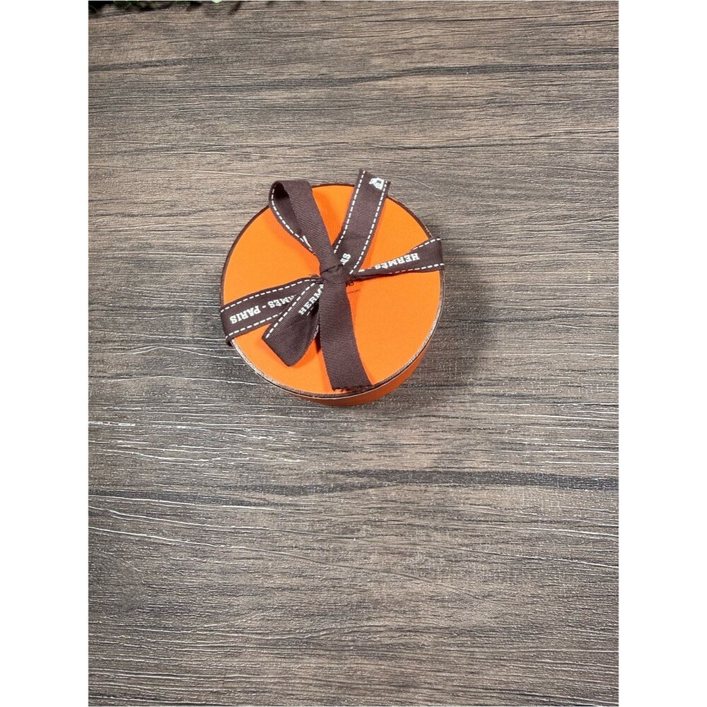 Hermès Round Orange Gift Box with Brown Ribbon